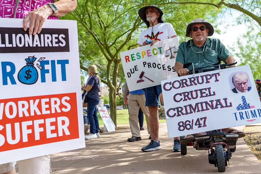protesters with anti-trump signs