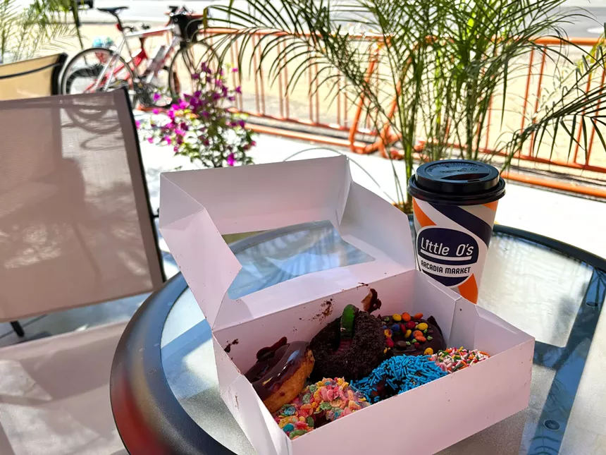 Coffee and a box of doughnuts.