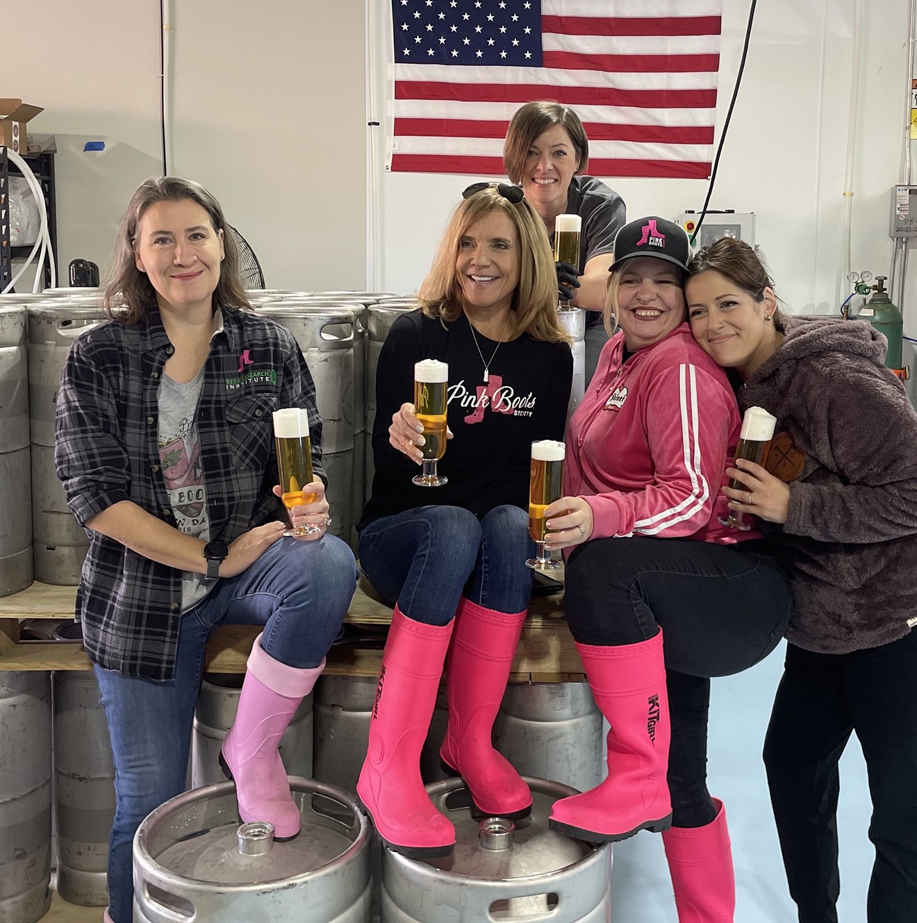 The Pink Boots Society Collaboration Brew Day at Hundred Mile Brewing Co. in Tempe drew members including Victoria Pietrasik, brewery owner Sue Rigler, head brewer Valerie Adee, Billie McGovern, and Liz Rosevear.
