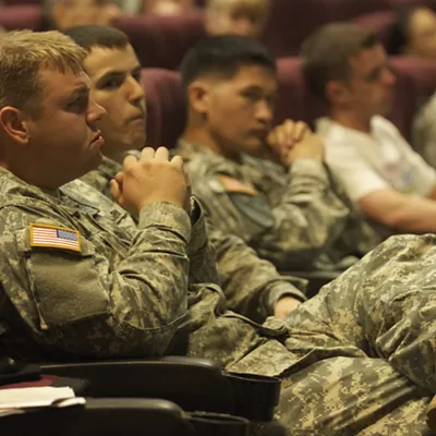 Veterans Affairs specialists brief troops on the educational benefits of the GI Bill.