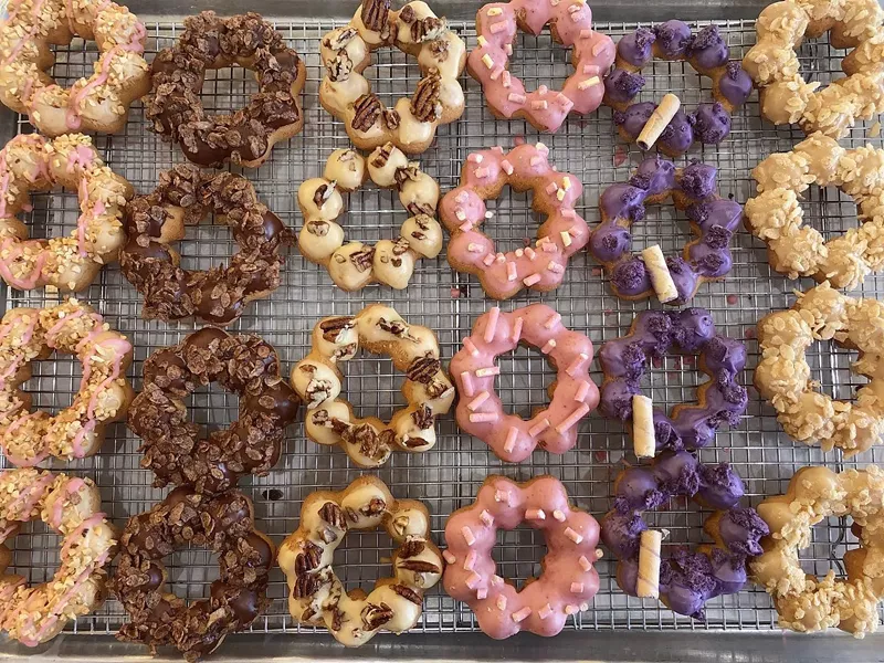 Image: The doughnuts come in the shape of eight interconnected dough balls and contain a blend of fried mochi, glaze, and different toppings.