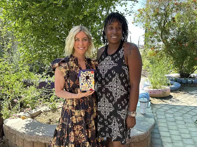 Image: The Bob & Renee Parsons Foundation recently made a donation to Local First Arizona of $1 million. Part of the funds will benefit Heart & Soil People's Garden. Renee Parsons (left) stands with Heart & Soil garden director Nika Forté.