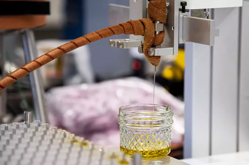 Image: Oil dripping into a glass