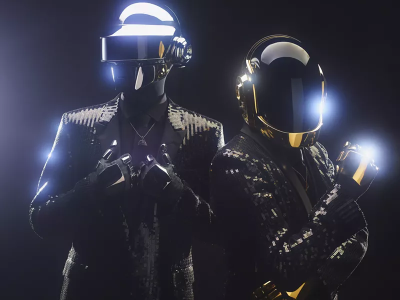 Image: Two men in costumes with helmets.