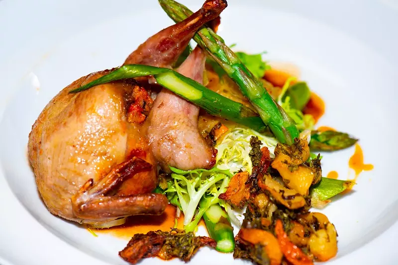 Image: Quail with organic vegetables is one of many colorful dishes on the menu at Sapiens Paleo Kitchen.
