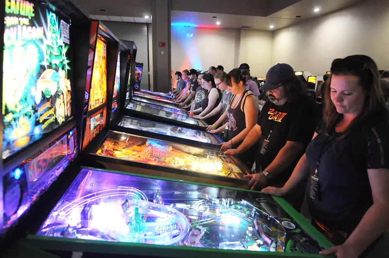 Image: A row of pinball games at ZapCon in Mesa.